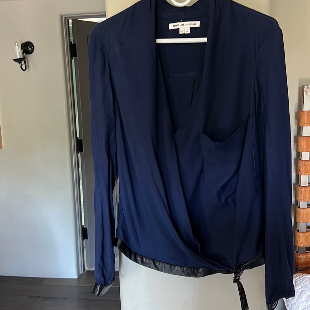 Viscose, wool, leather trim. Very rock and roll!